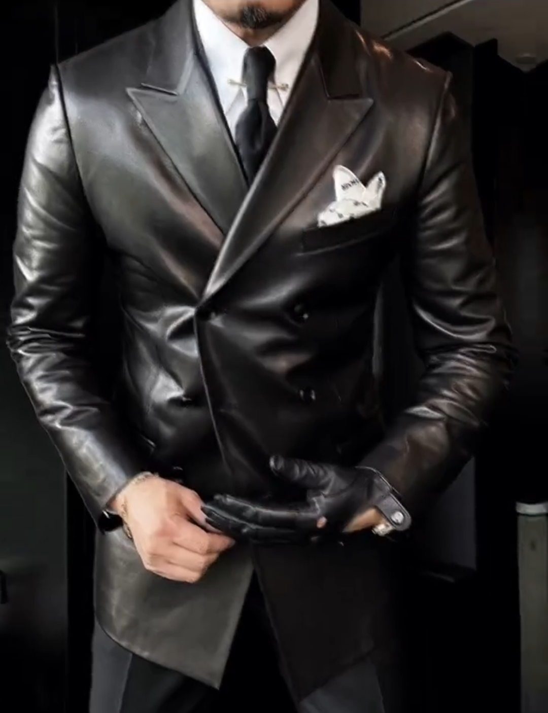 Double-breasted peak lapel suit